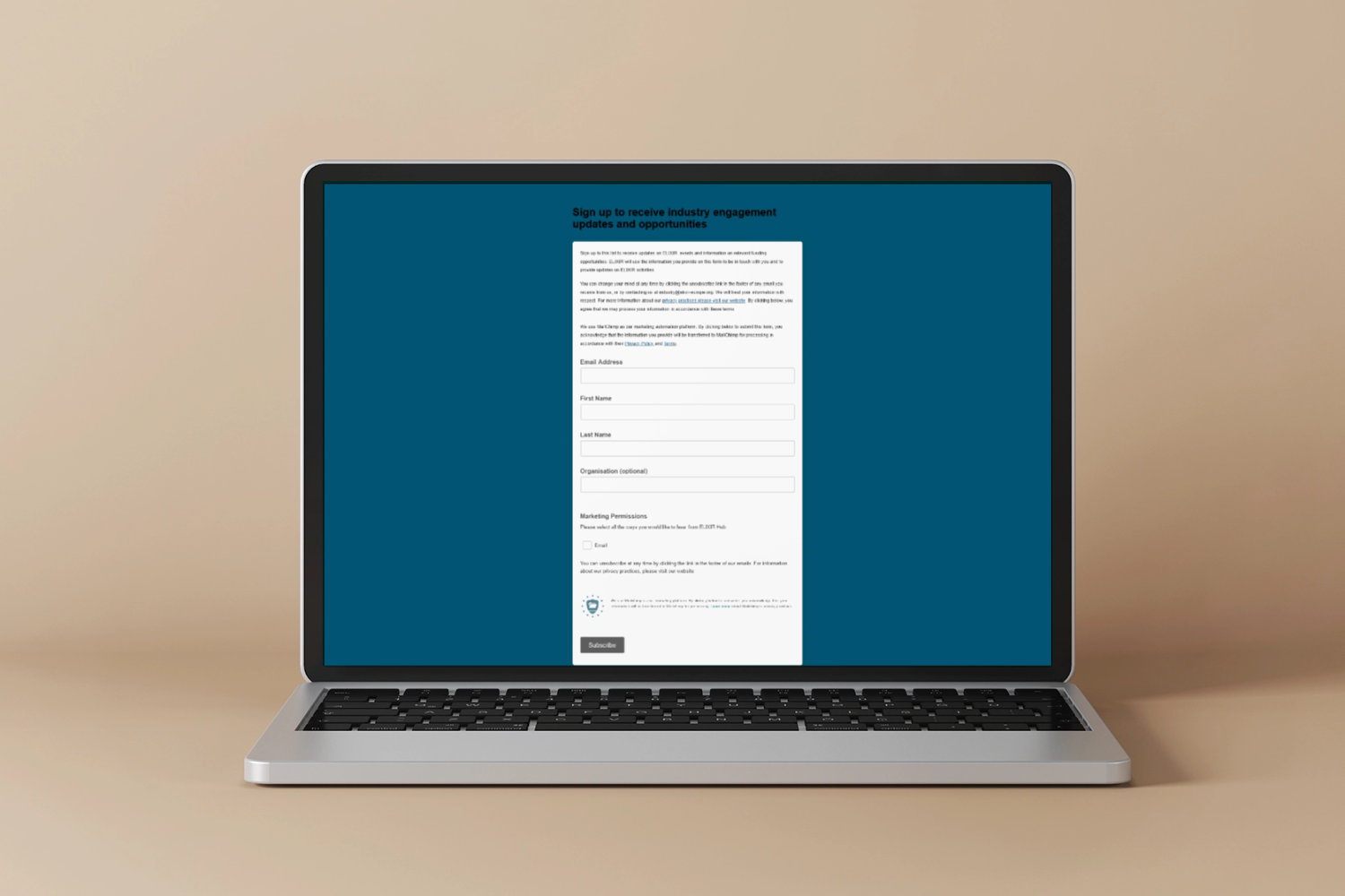 Laptop with the ELIXIR-IT newsletter interface on screen